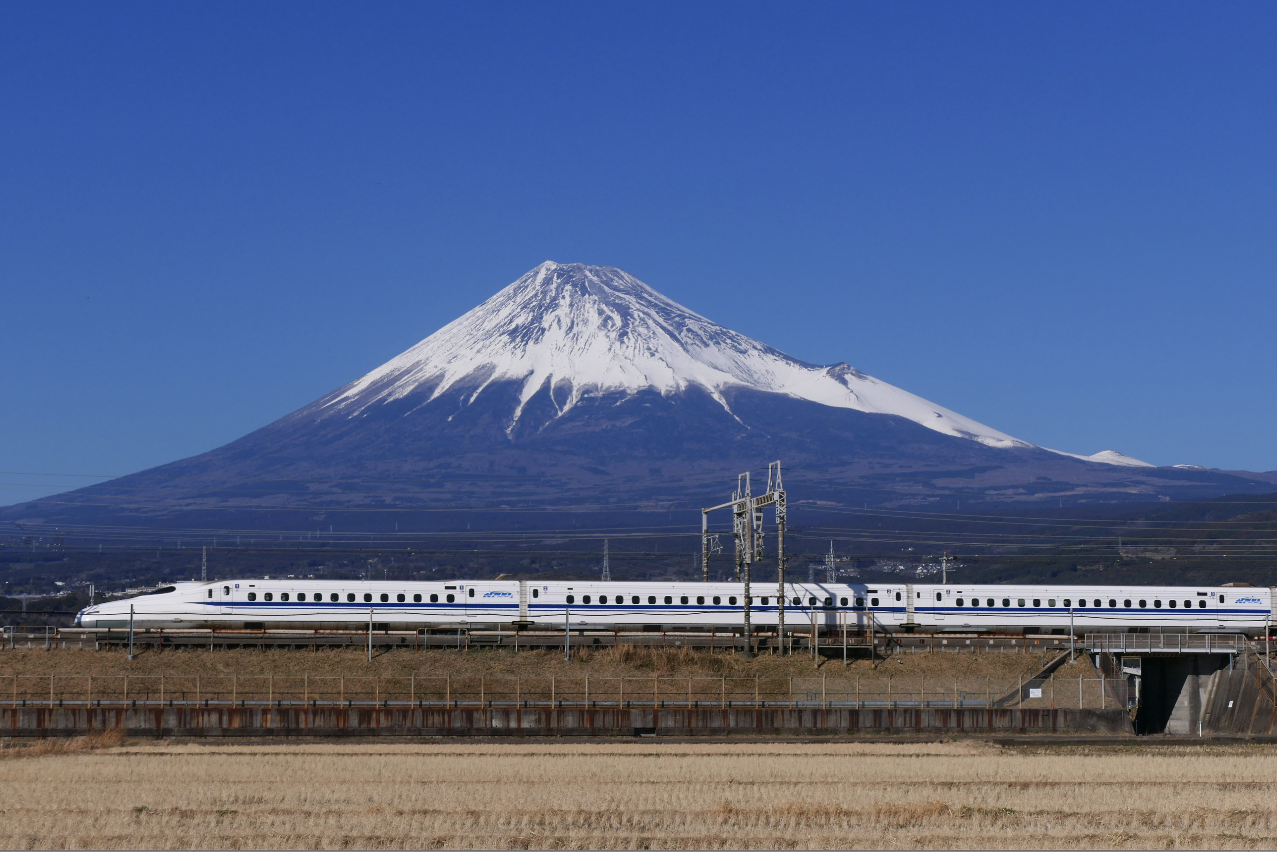 N700A series Tokaido Shinkansen traveling in Shizuoka Prefecture with Mount Fuji in the background